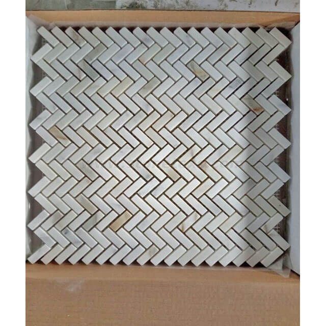 calacatta gold herringbone backsplash